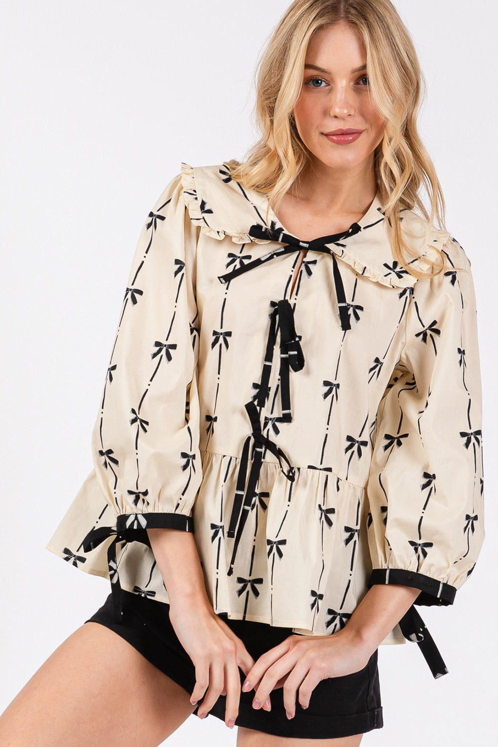 SAGE + FIG Bow Print Tie Front Ruffle Hem Relaxed Fit Babydoll Blouse | Cream