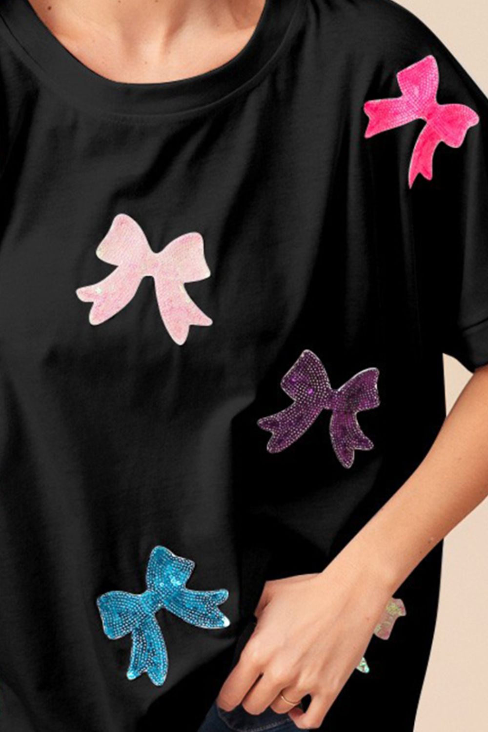 BiBi Solid Drop Shoulders Sequin Bows Patch Short Sleeves T-Shirt | Black